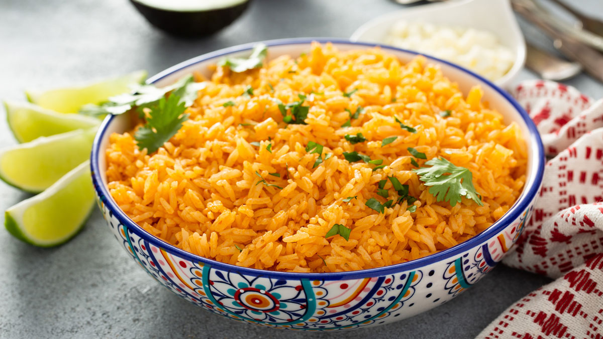 Mexican rice with tomatoes and onion served with cilantro